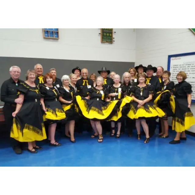 Square dance club in matching black and yellow outfits