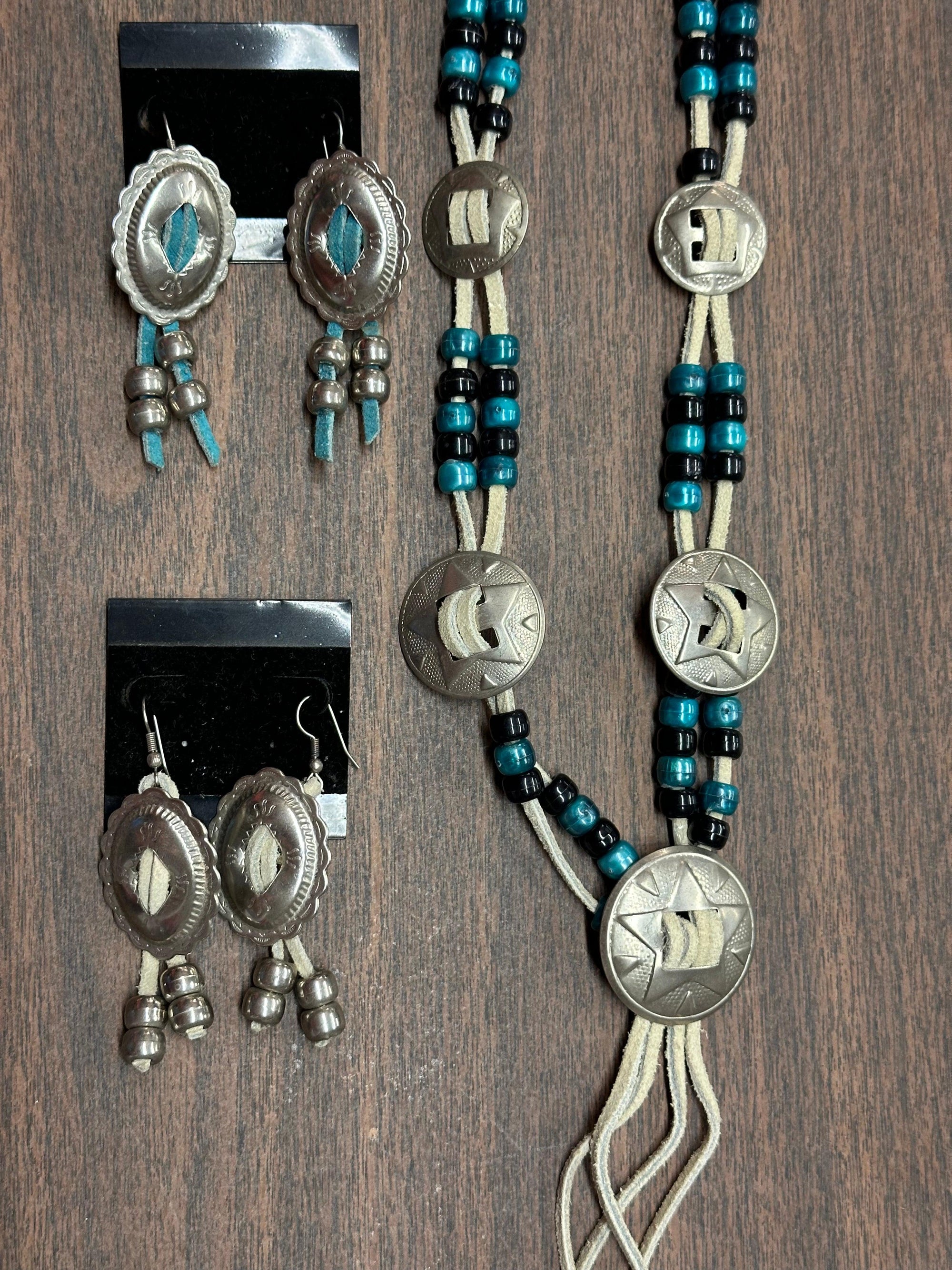 A matching set of Square Up Fashions Concho Necklace and earrings with turquoise beads.