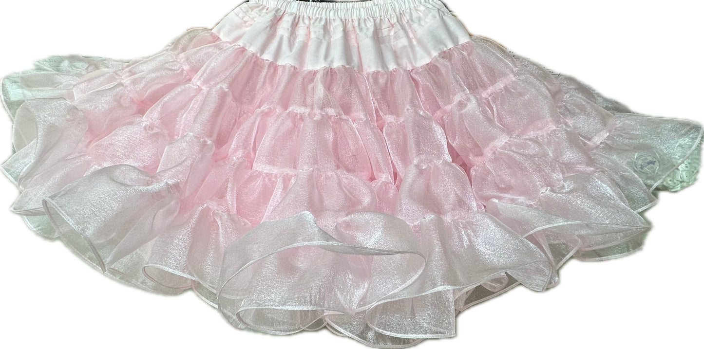 The Square Up Fashions Crystal Petticoat features pink, ruffled crystal fabric with a sheer, shimmery finish and an elastic waistband, shown against a white background.