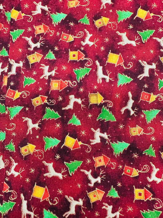 The Reindeer Ruffle Holiday Outfit by Square Up Fashions features red fabric with green Christmas trees, colorful houses, white reindeer, and gold stars—ideal for festive looks this season.
