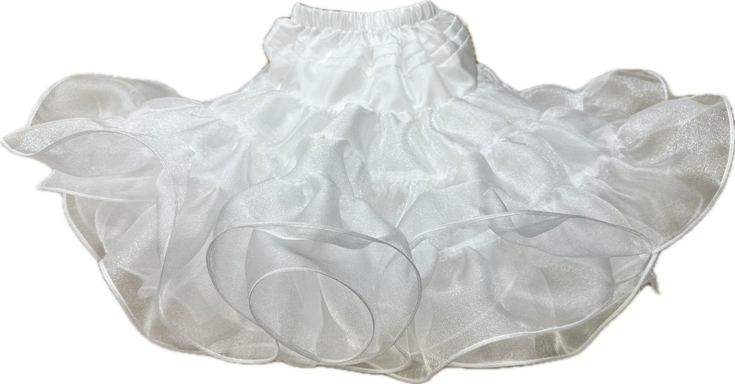 The Childrens Crystal Petticoat by Square Up Fashions is a white, super full petticoat with ruffled, sheer layered fabric and a fitted elastic waistband.