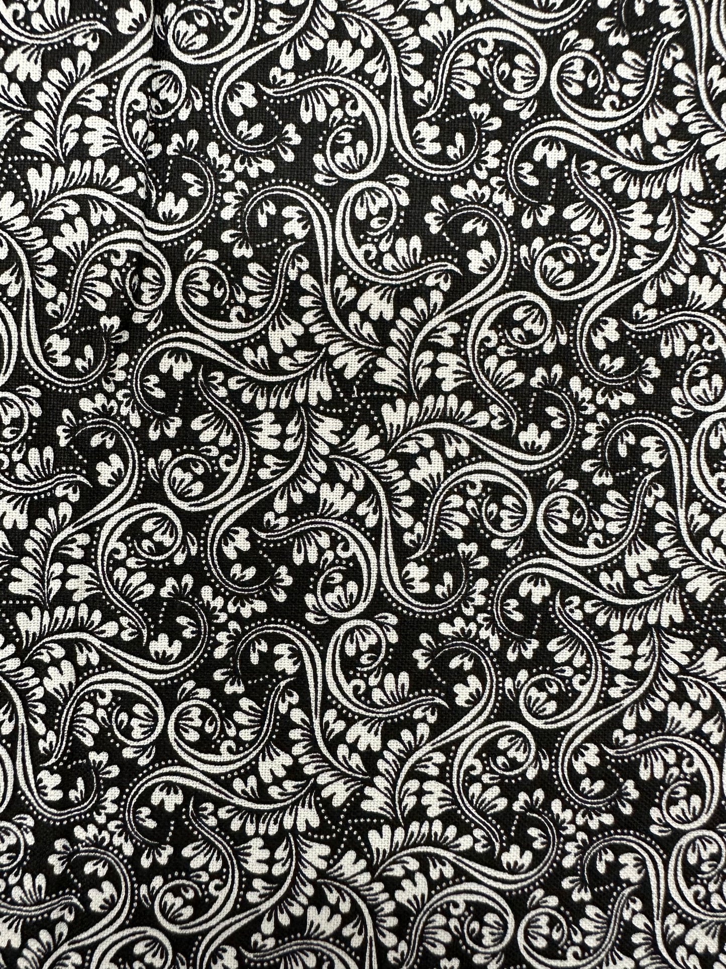 The Black Elegant Ruffled Square Dance Outfit by Square Up Fashions showcases intricate white floral and paisley patterns with swirling vines and leaves, perfect for making a statement at your next dance.