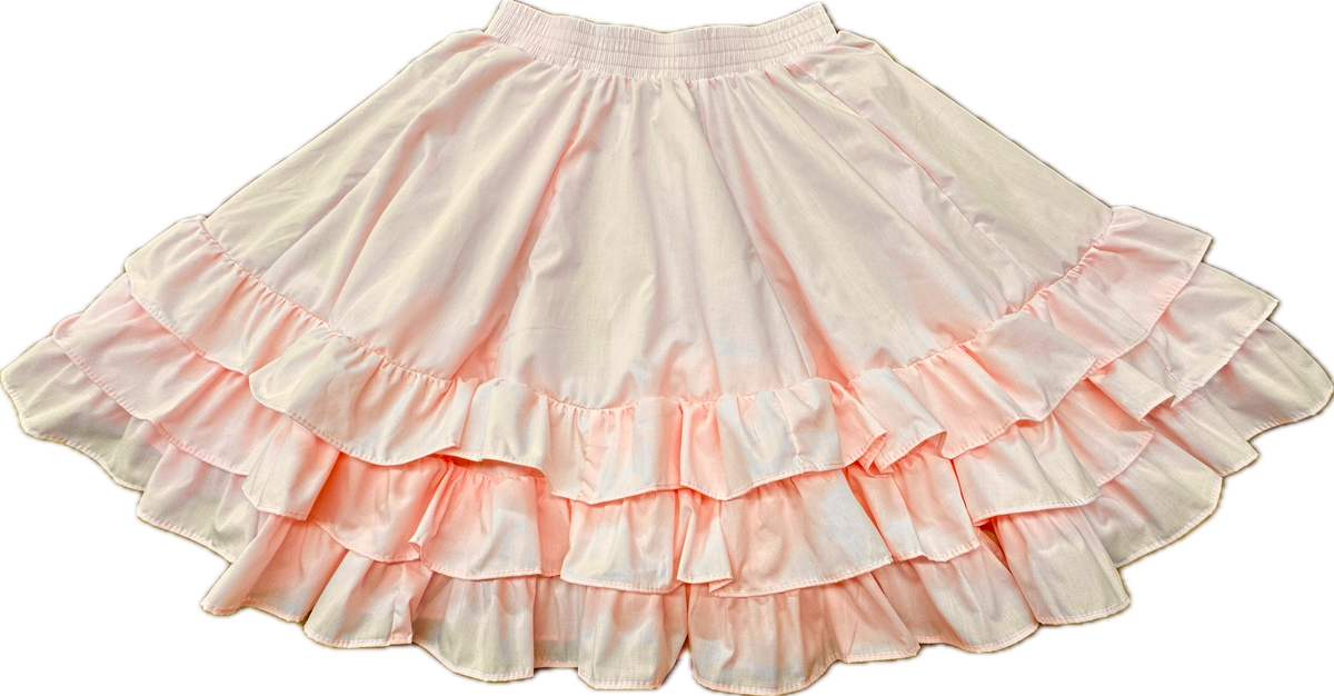 The Square Up Fashions 3 Ruffle Square Dance Skirt is a light pink skirt with three ruffle layers and an elastic waistband, shown laid flat on a white background. Custom sizes available for the perfect fit.