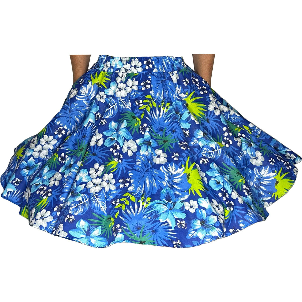 A woman wearing a Tropical Hawaiian Square Dance Skirt from Square Up Fashions with hibiscus flowers and palm leaves.