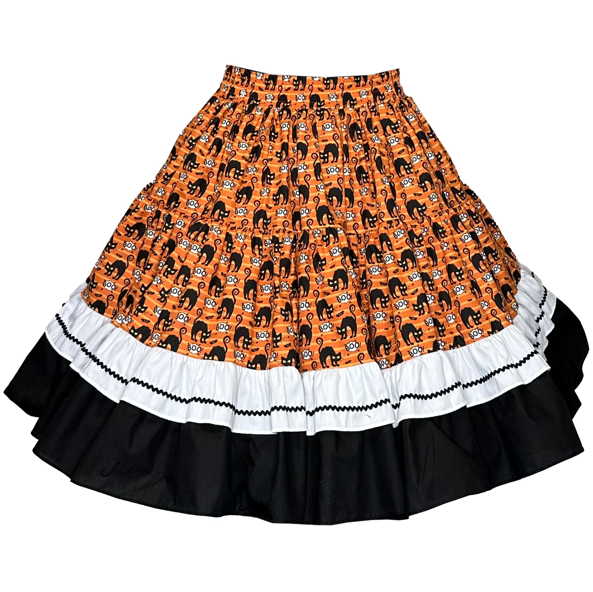 The Scared-y Cat Square Dance Skirt by Square Up Fashions is a knee-length orange Halloween skirt with a scared-y cats pattern, white ruffle, black trim, and a wide black ruffle at the hem.