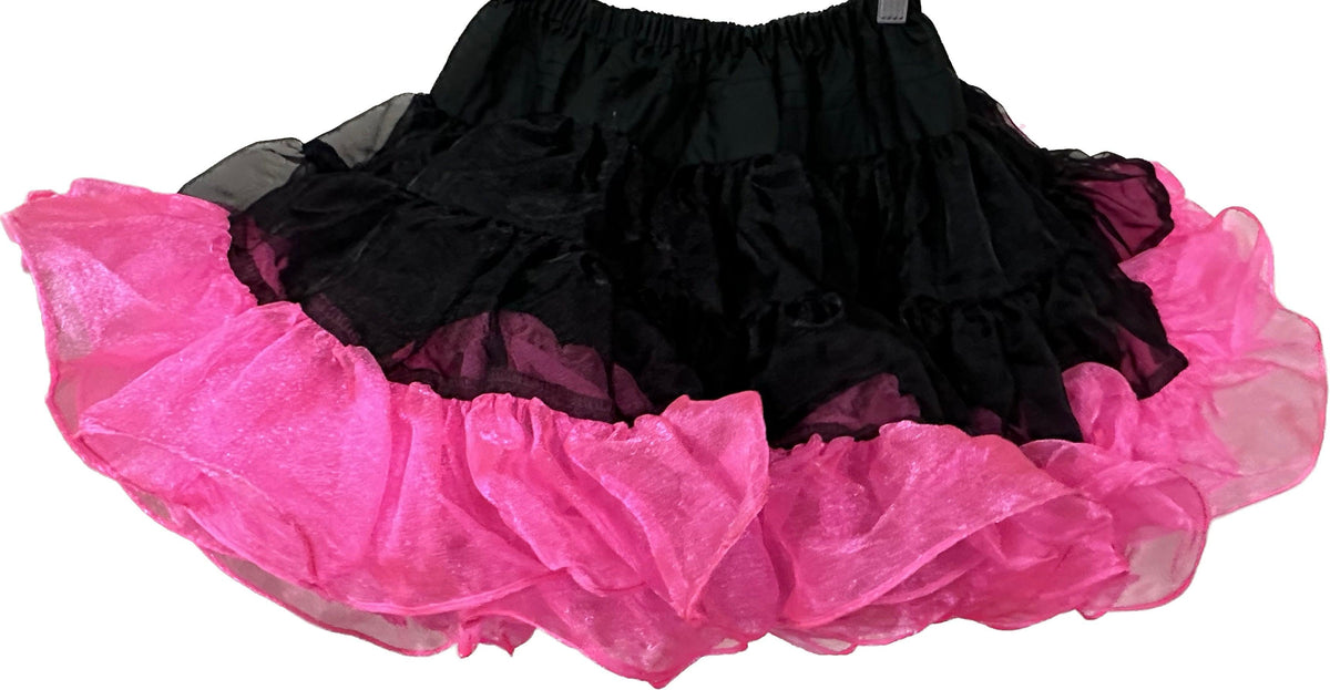 A CLEARANCE Childrens Crystal Petticoat skirt made of nylon crystal fabric is hanging on a hanger. It is from Square Up Fashions.