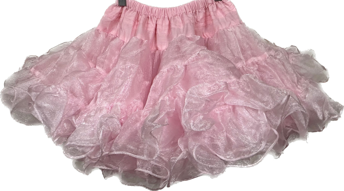 An adjustable CLEARANCE Childrens Crystal Petticoat made of nylon crystal fabric, hanging on a hanger. Brand Name: Square Up Fashions.