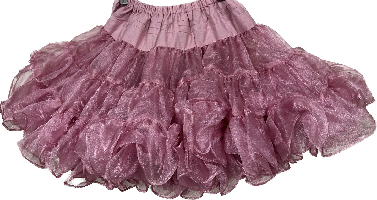An adjustable CLEARANCE Children&#39;s Crystal Petticoat skirt by Square Up Fashions hanging on a hanger.