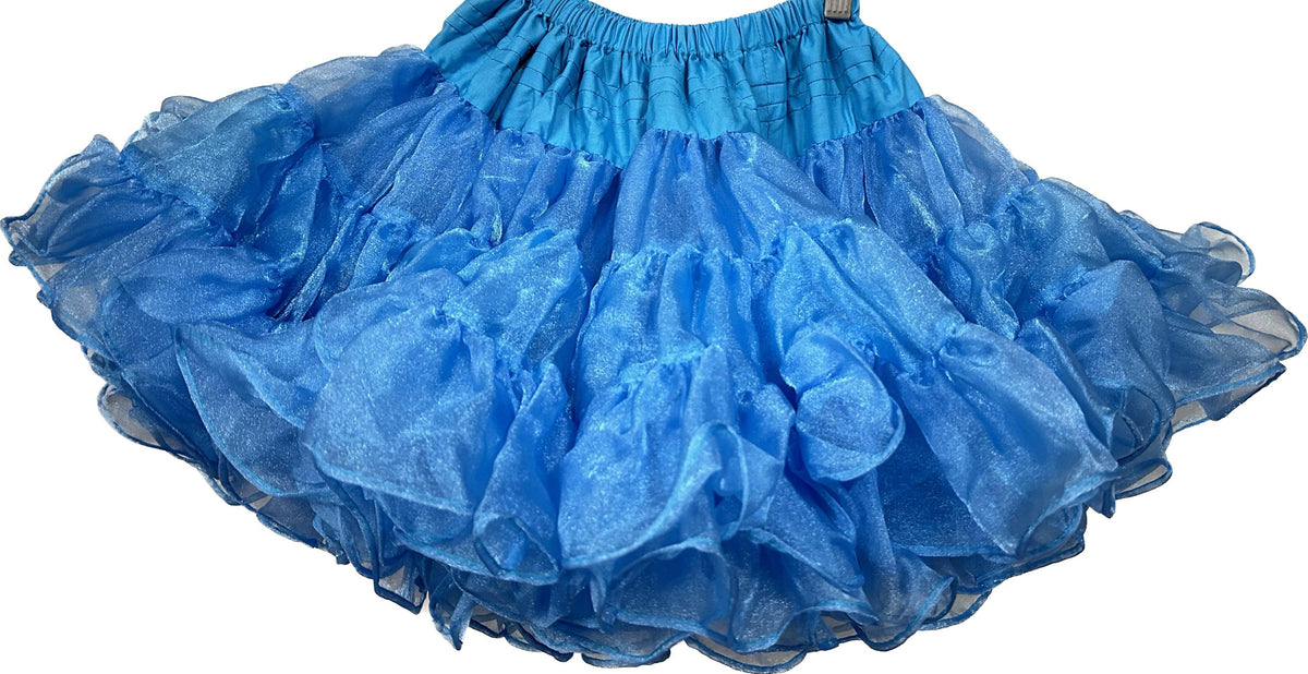 An adjustable CLEARANCE Childrens Crystal Petticoat made by Square Up Fashions, hanging on a hanger.
