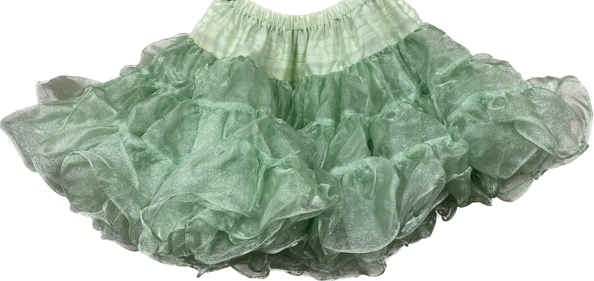 An adjustable CLEARANCE Childrens Crystal Petticoat made of nylon crystal fabric, hanging on a white background.
Brand Name: Square Up Fashions