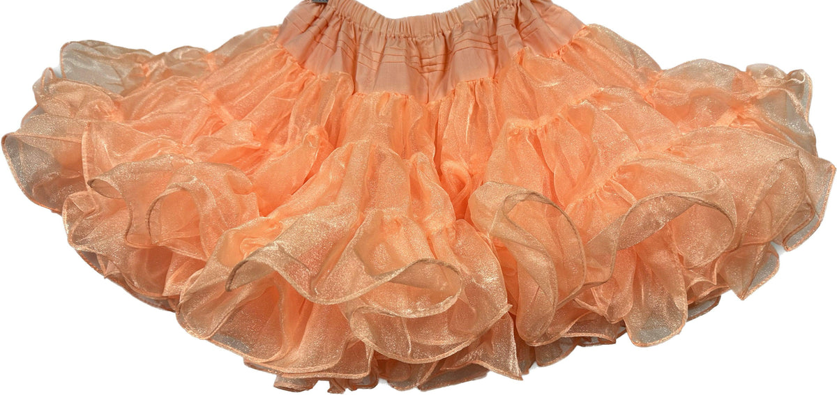 An adjustable CLEARANCE Childrens Crystal Petticoat made of nylon crystal fabric, hanging on a white background. (Brand: Square Up Fashions)