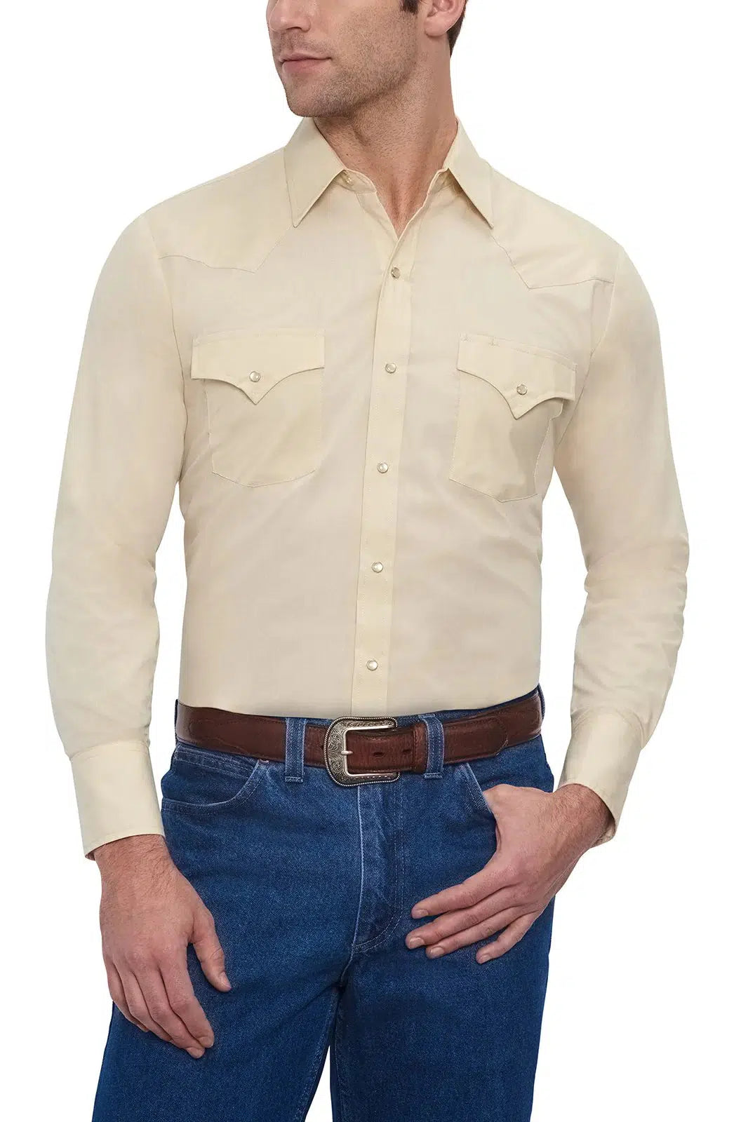 A man wearing an ELY Men&#39;s Long Sleeve Solid Western Snap Solid Shirt with Western Yokes and jeans.