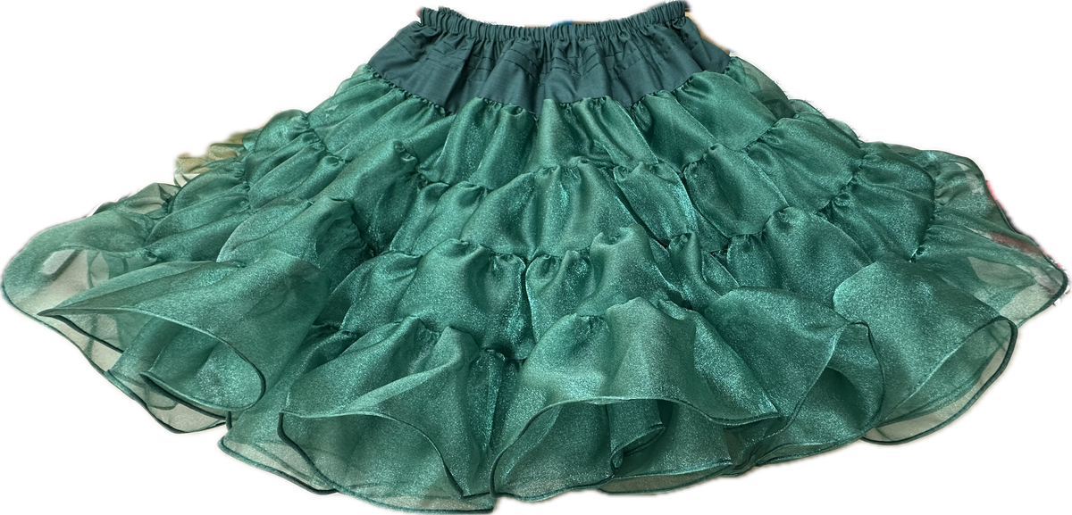 A teal flamenco skirt with ruffles and sparkle on a black background from Square Up Fashions featuring the Crystal Petticoat.