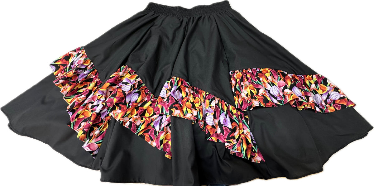 A Diagonal Pinwheel Square Dance Skirt with vibrant ruffles on it by Square Up Fashions.