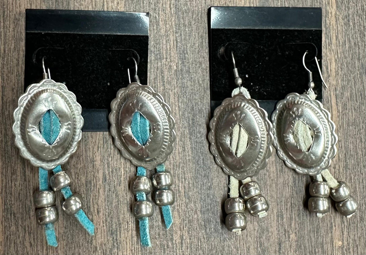 A pair of Concho earrings with turquoise beads by Square Up Fashions.