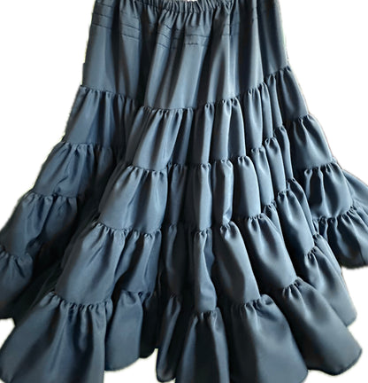 The DISCOUNTED Softer Poly-Liner Petticoat by Square Up Fashions, available in 4 colors, is perfect as a square dance petticoat. Shown here in dark gray polyester with long tiered ruffles against a white background.