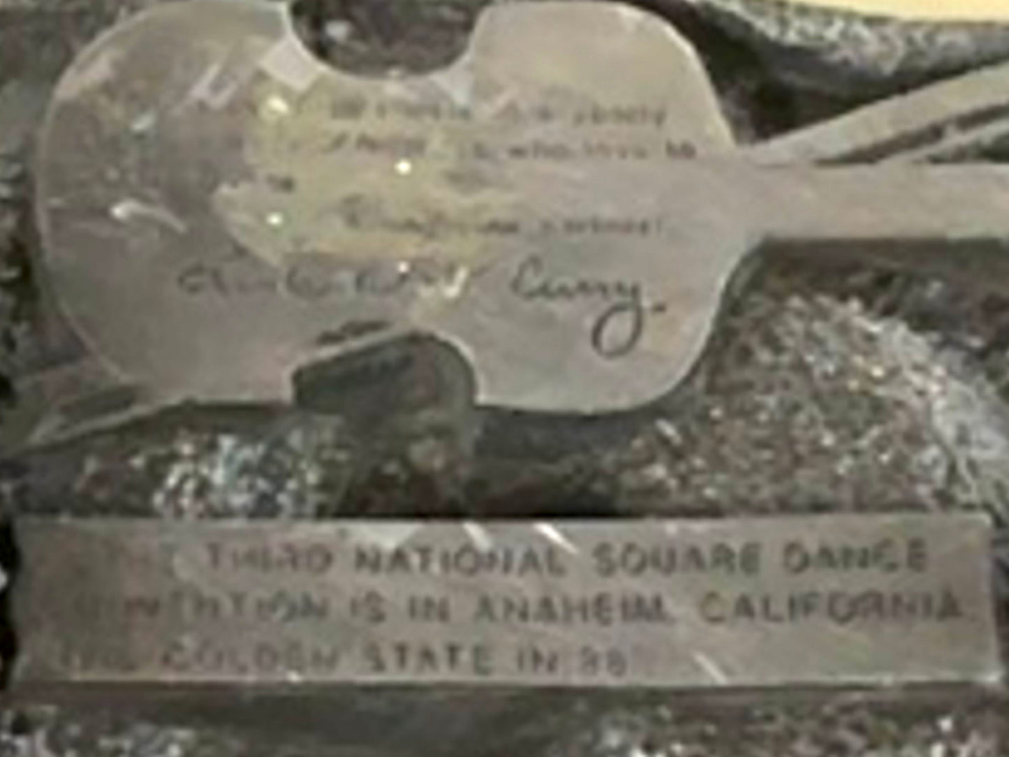 Square Up Fashions' Square Dance Buckle w/ instruments features a guitar-shaped design and engraved text commemorating the 1954 Third National Square Dance Convention in Anaheim, California—the "Golden State.