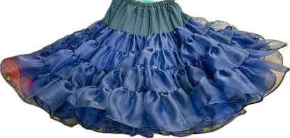 The Square Up Fashions Crystal Petticoat is a navy blue, multi-layered ruffled skirt with a high elastic waistband, shown on a white background.