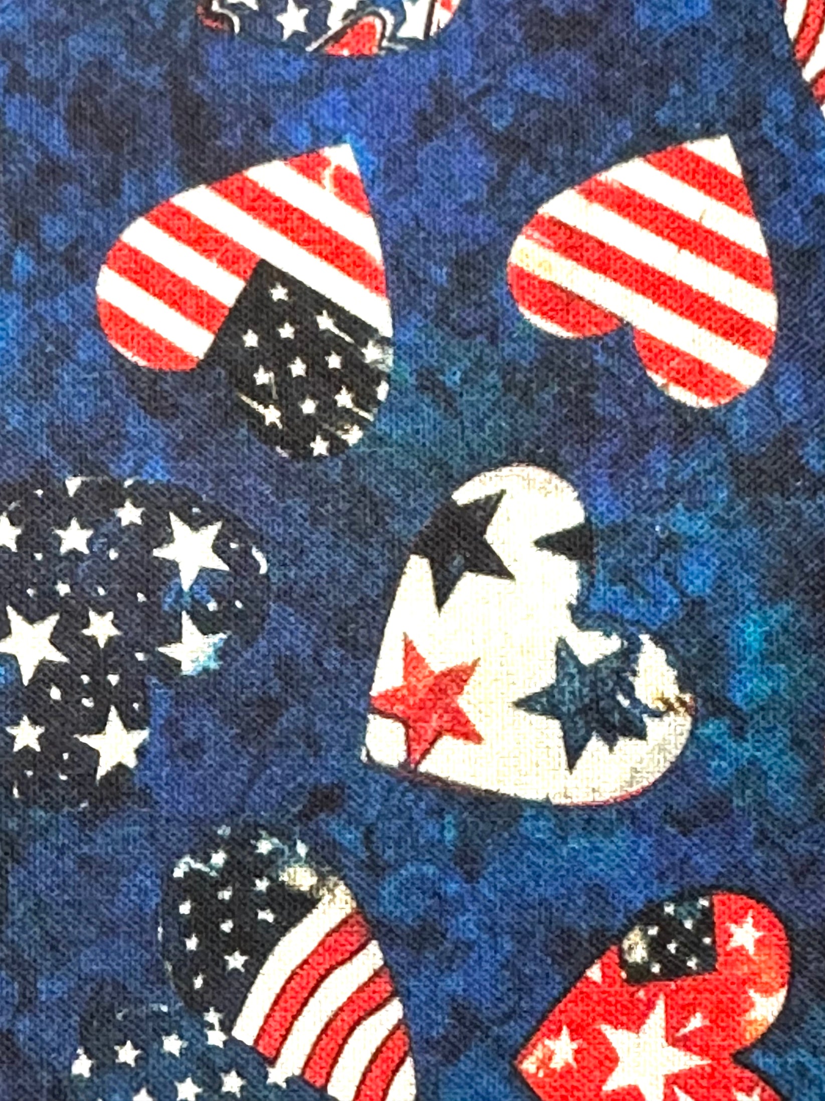 The Square Up Fashions Americana Square Dance Skirt features heart-shaped American flag designs on mottled blue fabric—ideal for square dancing or celebrating the 4th of July in patriotic style.