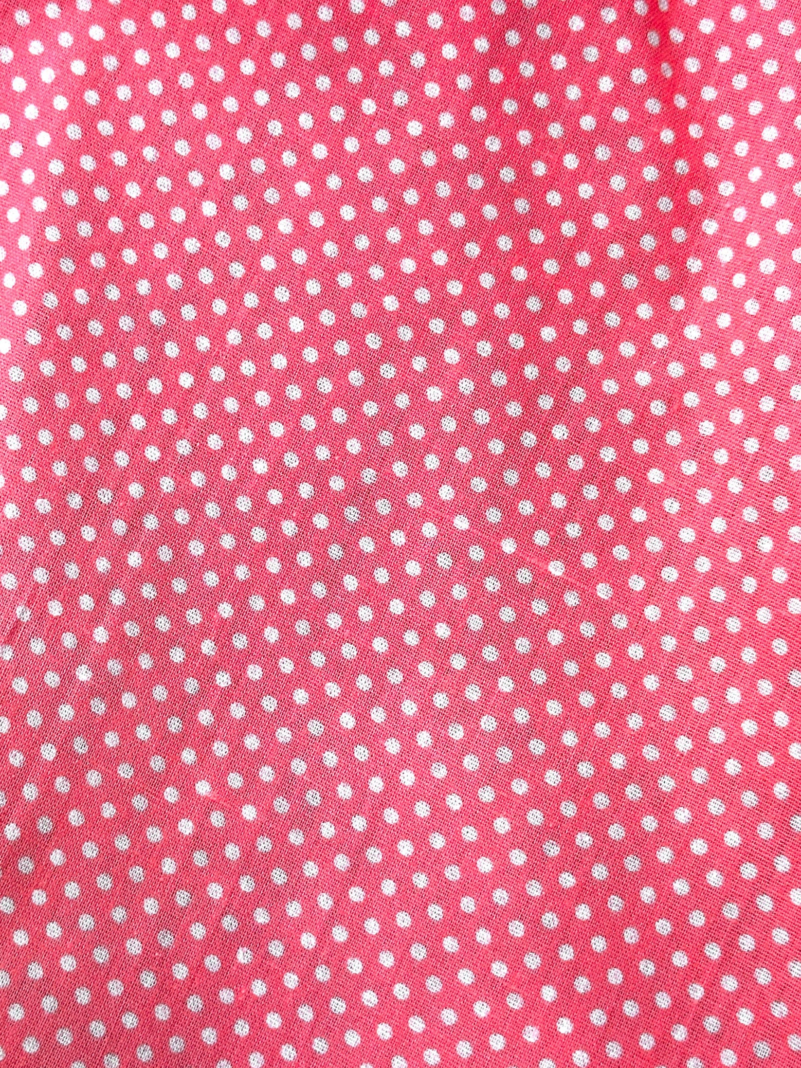 Close-up of the CLEARANCE Polka Dot Scarf Ties by Square Up Fashions, featuring pink fabric with evenly spaced small white polka dots, inspired by classic Swiss designs.