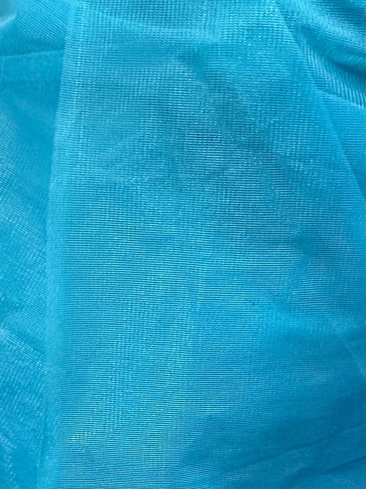 A close up image of a Square Up Fashions double layered slip in a blue nylon Organdy Stiff Petticoat fabric.