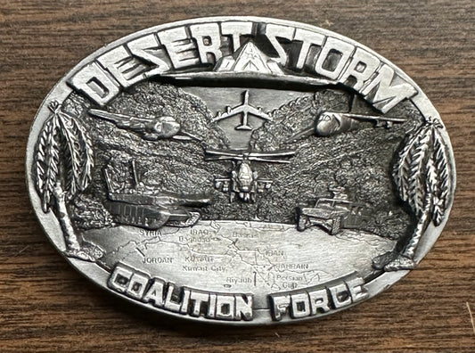 The Desert Storm Square Dance Buckle by Square Up Fashions features “Desert Storm Coalition Force” text, military vehicles and aircraft above a Middle East map, commemorating Operation Desert Storm.