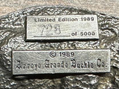 A close-up of the Square Up Fashions Square Dance Buckle w/caller shows "Limited Edition 1989, 728 of 5000" and "© 1989 Arroyo Grande Buckle Co." engraved on textured metal—a true USA-made commemorative from 1989.