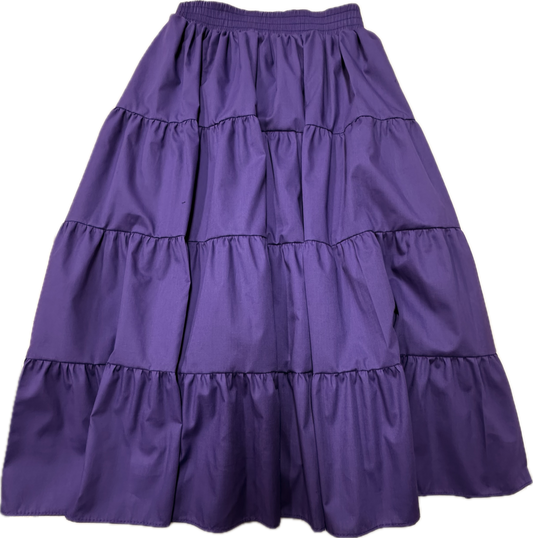 The Basic 4 Tier Prairie Skirt by Square Up Fashions is a purple, ankle-length A-line skirt with four tiers, an elastic waistband, and gathered ruffle details. Custom sizes available.