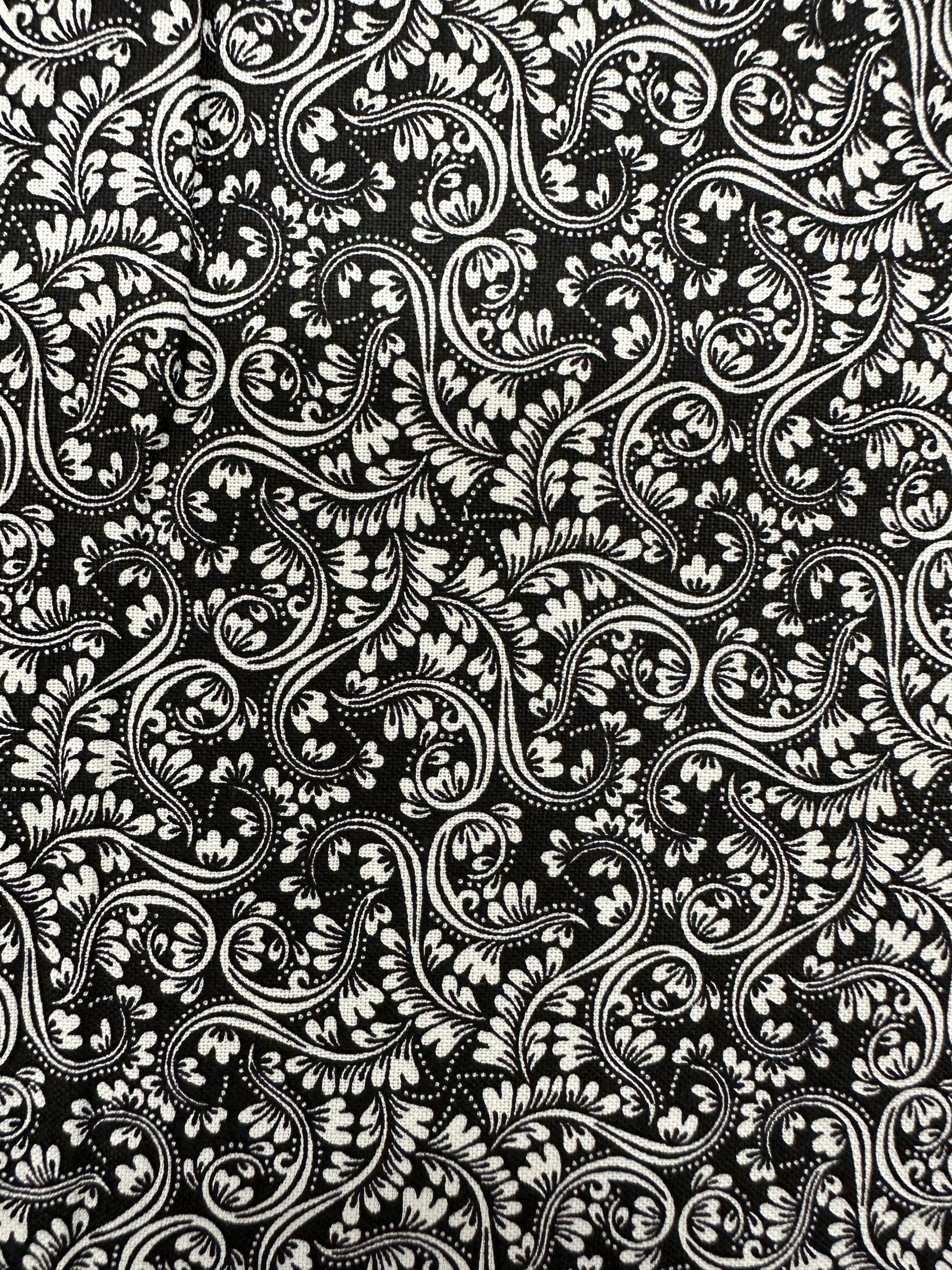 The Black Elegant Ruffled Square Dance Skirt by Square Up Fashions features a black and white floral pattern, ideal for adding elegance to dance outfits or making a stylish statement at formal events.