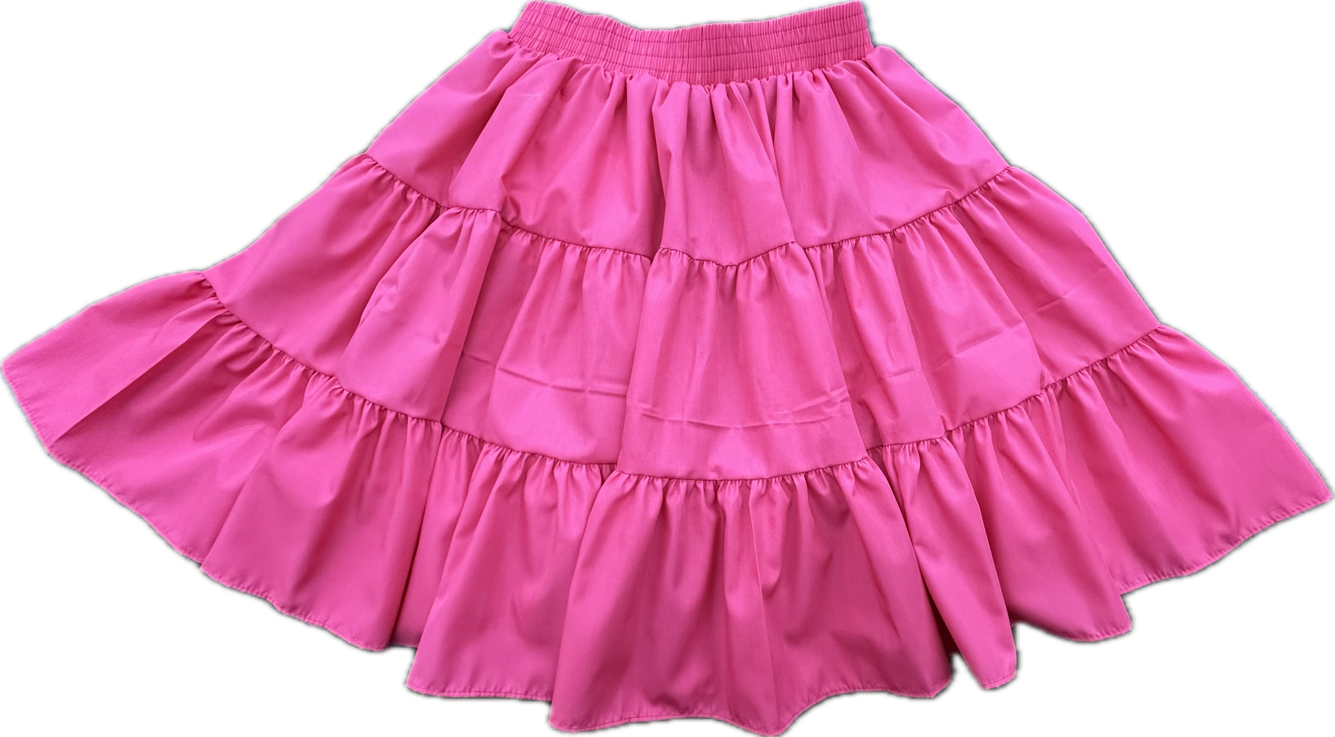 The Basic 3 Tier Square Dance Skirt by Square Up Fashions features a pink flared silhouette, elastic waistband, and three ruffled layers—perfect for adding a stylish touch to any wardrobe.