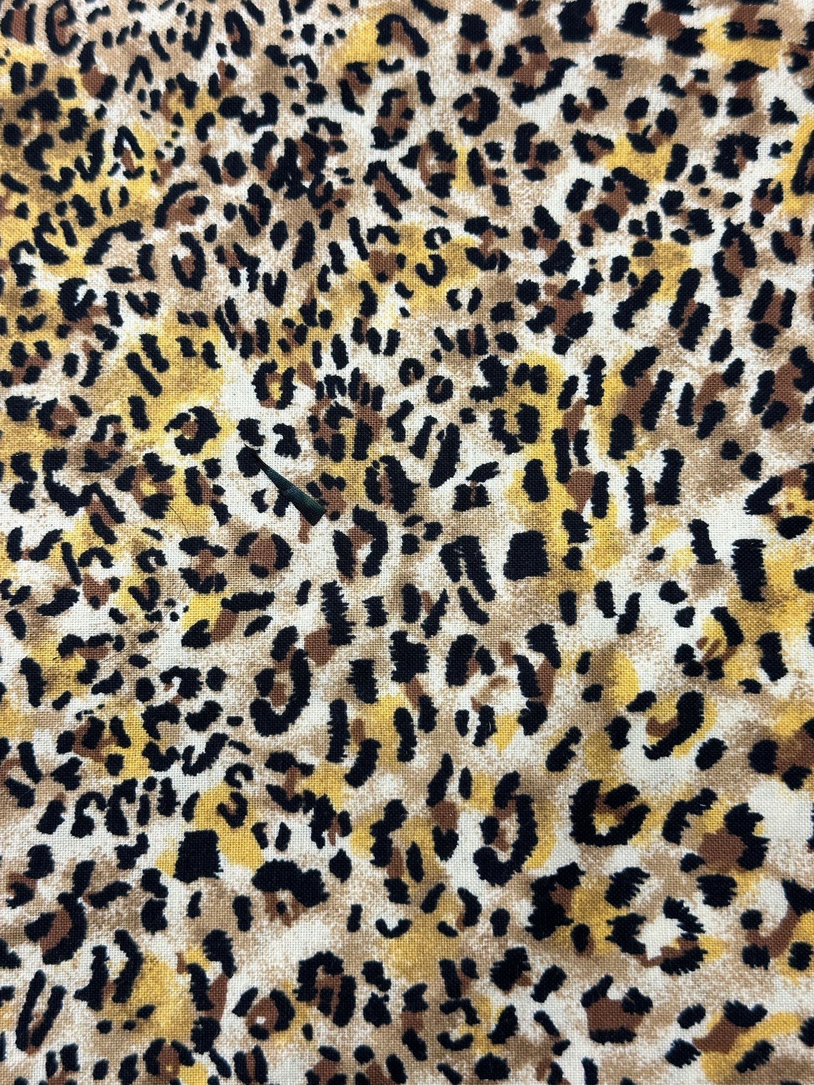 Close-up of the Wild Animal Print Skirt by Square Up Fashions, featuring a bold leopard pattern in yellow, brown, black, and white—perfect for making a striking style statement.