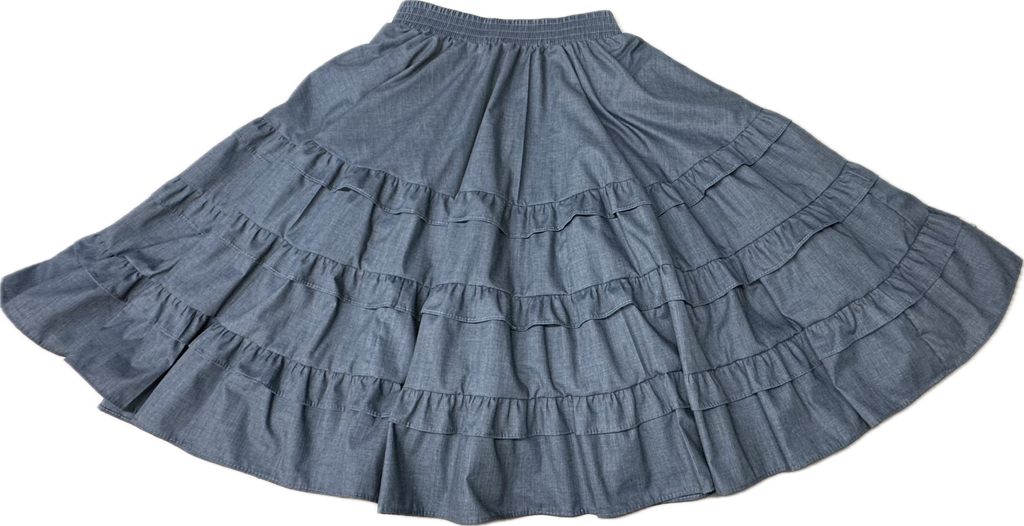 The Double Ruffle Square Dance Skirt by Square Up Fashions is a long blue skirt with an elastic waistband and layered double ruffles, shown in custom sizes laid flat.