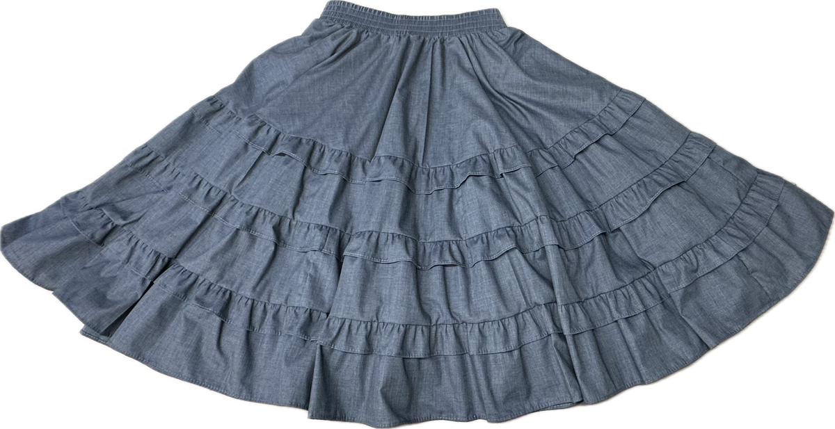 The Double Ruffle Square Dance Skirt by Square Up Fashions is a long blue skirt with an elastic waistband and layered double ruffles, shown in custom sizes laid flat.