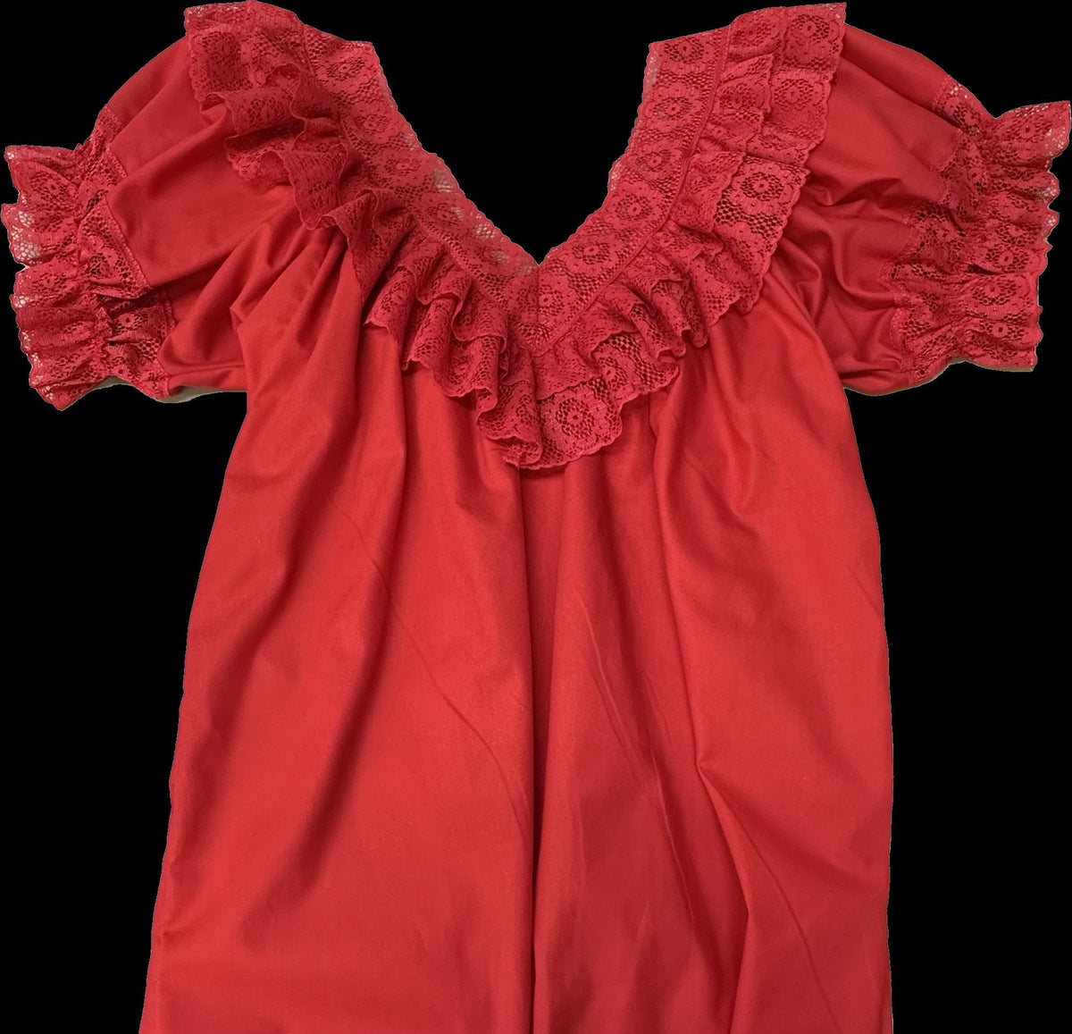 An Fiesta V-Neck Blouse from Square Up Fashions with ruffles on it.