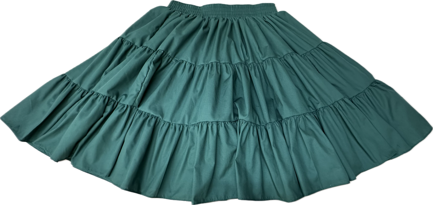 The Square Up Fashions Basic 3 Tier Square Dance Skirt in green features an elastic waistband and a classic, versatile design—an essential addition to any wardrobe. Shown laid flat against a white background.