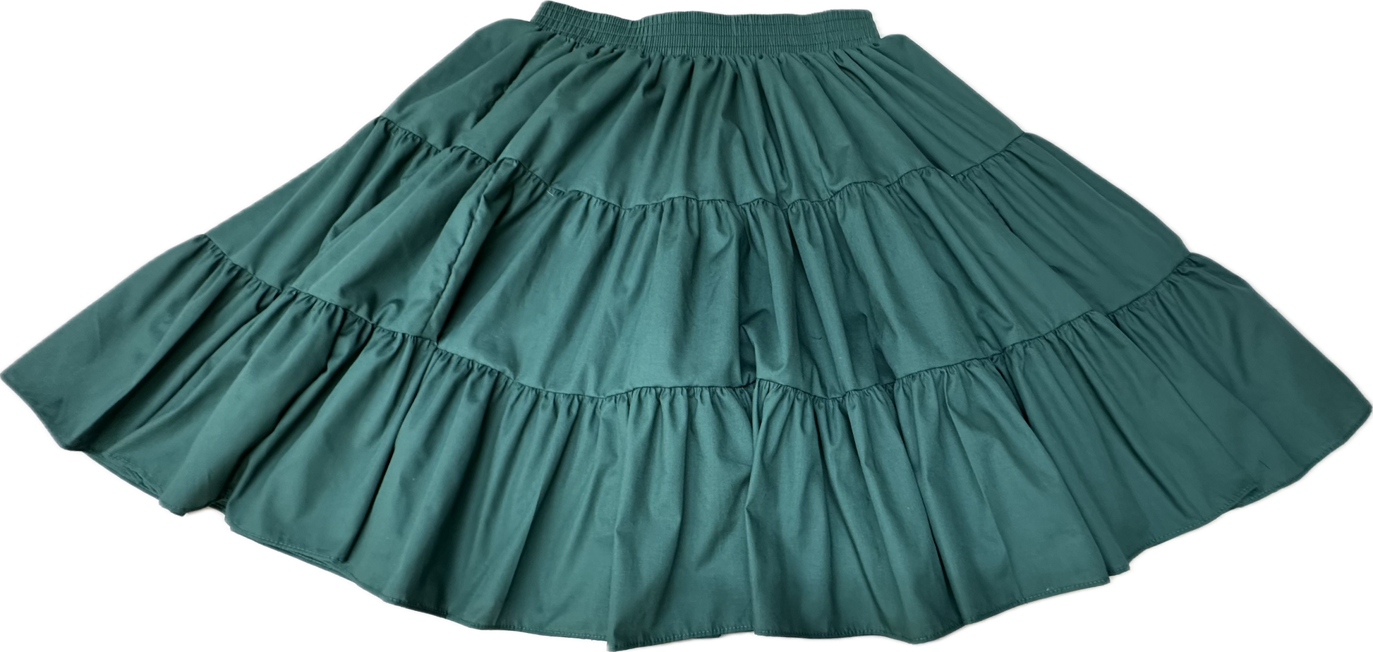 The Square Up Fashions Basic 3 Tier Square Dance Skirt in green features an elastic waistband and a classic, versatile design—an essential addition to any wardrobe. Shown laid flat against a white background.