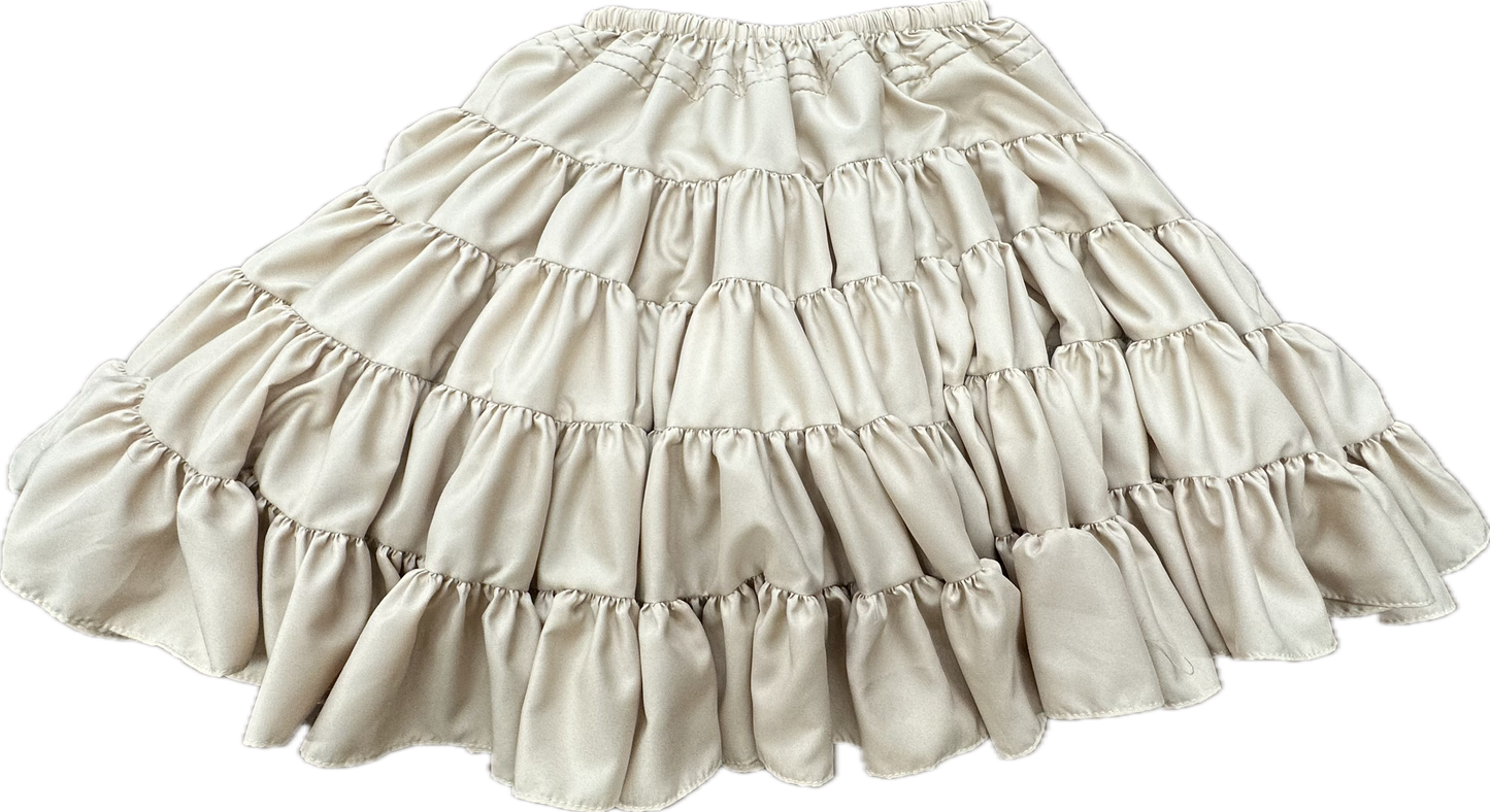 The DISCOUNTED Softer Poly-Liner Petticoat by Square Up Fashions is a cream-colored, tiered ruffle skirt with an elastic waistband, ideal as a square dance petticoat or adjustable slip. Available in 4 colors!.