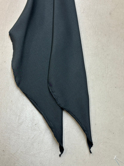 A CLEARANCE Light Weight Thin Polyester Scarf Tie by Square Up Fashions, in solid black with two pointed ends, rests on a light textured surface.