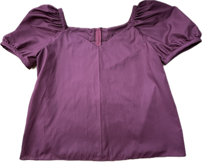 The Square Up Fashions Sweetheart Neck Blouse is a short-sleeved purple top with puffed sleeves, a subtle sweetheart neckline, and a small front V detail, laid flat on a white background for a chic look.