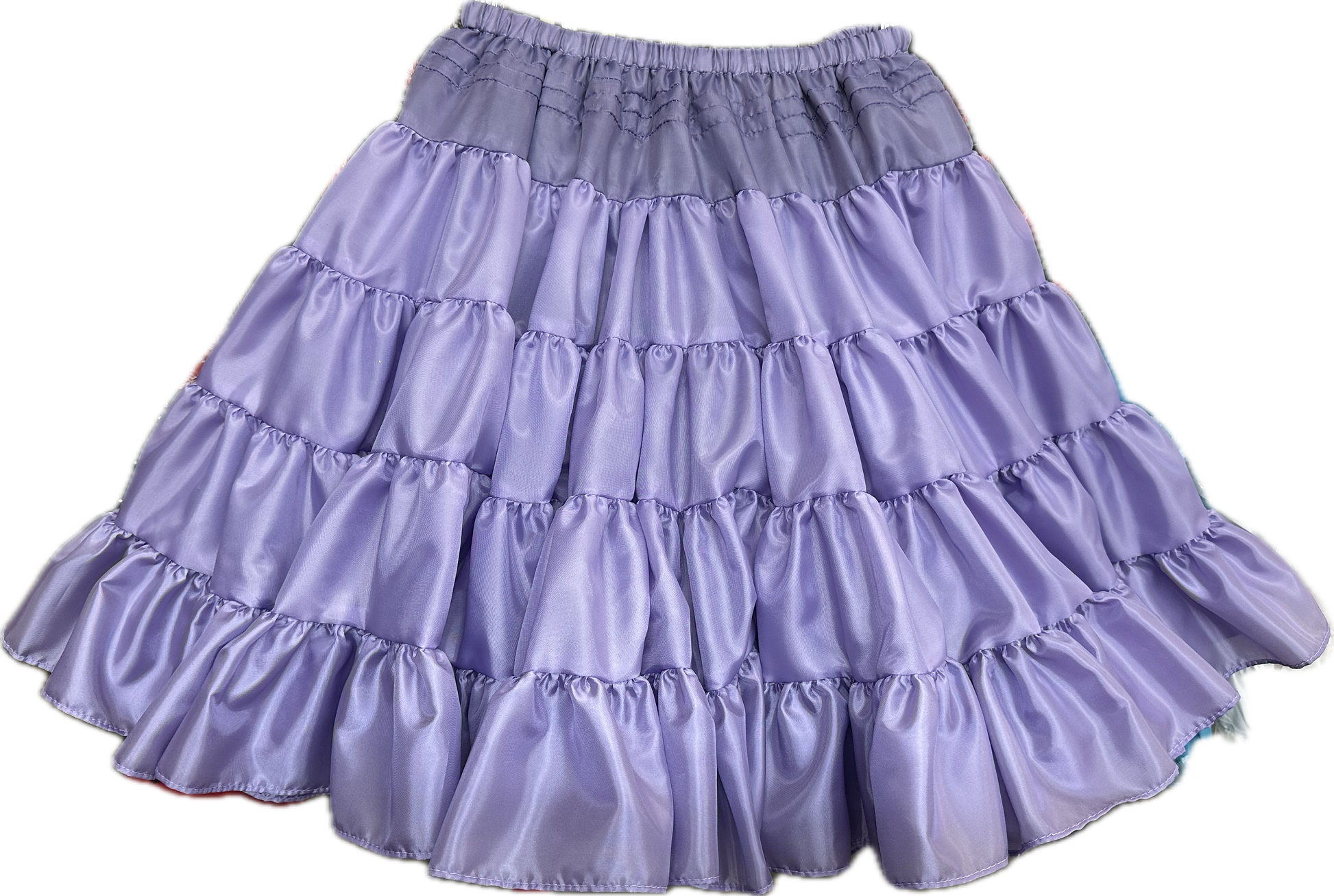 The Soft Poly-Liner Petticoat by Square Up Fashions is a lavender, knee-length skirt with ruffled tiers and an elastic waistband—ideal as a petticoat or for square dancing.