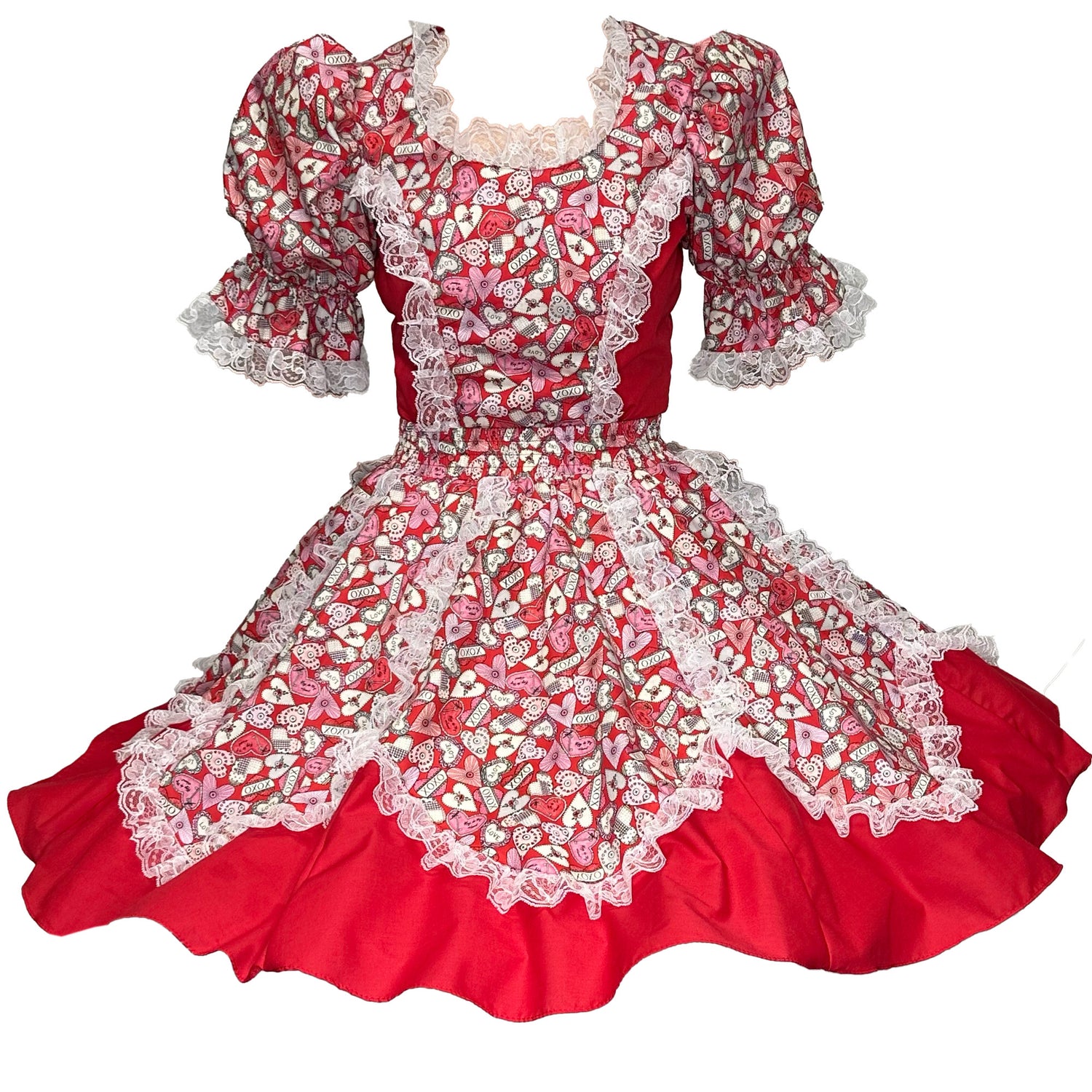 The I Heart You Square Dance Outfit by Square Up Fashions features puffed short sleeves, lace trim, and a white-and-pink heart and sweets print with a flared, layered skirt for a romantic Valentine’s Day style.