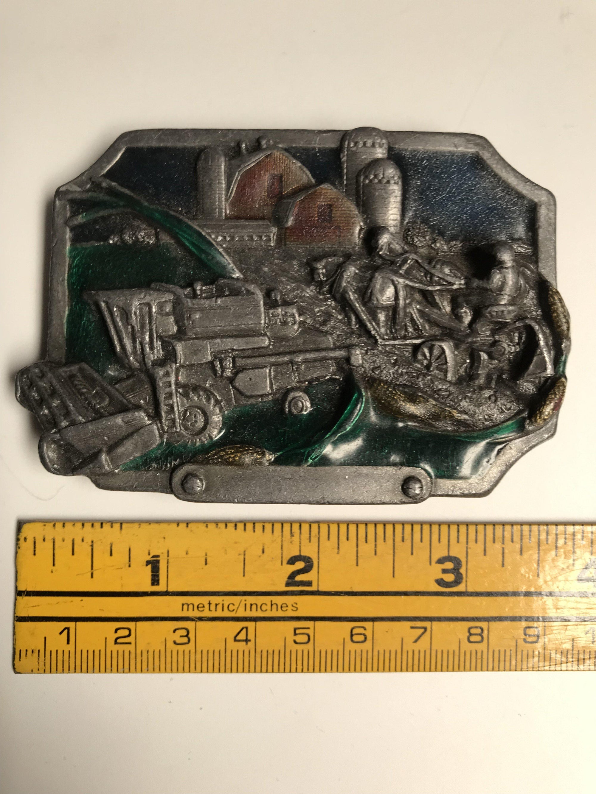 A Square Dance Buckle with a picture of a train on it, manufactured by Square Up Fashions.