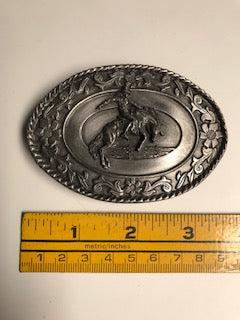 A Square Dance Buckle from Square Up Fashions featuring a cowboy and horse in action.