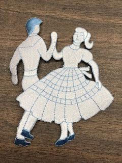 A picture of a couple dancing on a table adorned with Square Dance Embroidered Patches by Square Up Fashions.