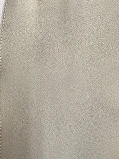 A close-up of a CLEARANCE Middle Weight Polyester Scarf Ties with a zipper made of solid color fabric by Square Up Fashions.