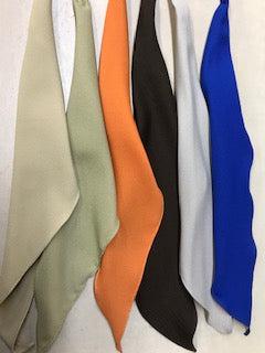 Five CLEARANCE Middle Weight Polyester Scarf ties by Square Up Fashions hanging on a wall.