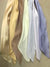 A group of different colored CLEARANCE Light Weight Polyester Scarf Ties by Square Up Fashions on a table.