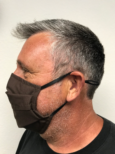 A man wearing a Square Up Fashions washable &amp; reusable brown face mask.