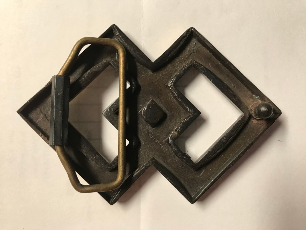A Square Dance Buckle with double interlocking squares and a brass handle by Square Up Fashions.